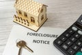 Notice of foreclosure of a house. Concept of eviction for non-payment of a mortgage to the bank. Rising interest rates. House and
