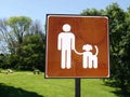 A notice in a park advising people must have dogs on a lead