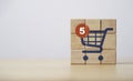 Notification number on shopping trolley cart icon print screen on wooden cube block for alarming of order of e-commerce and online