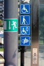 Notification stickers with symbols for disabled persons and visually impaired persons on glass elevator entrance platform