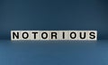 Notorious. Cubes form the word Notorious Royalty Free Stock Photo