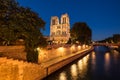 Notre Dame Cathedral illuminated at twilight. Summer in Paris, France Royalty Free Stock Photo