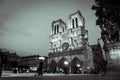 Notre Dame Cathedral lit up at night in black and white Royalty Free Stock Photo