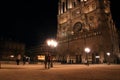 Notre Dame Cathedral in Paris and its lighting with tourists at night