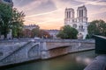 Notre Dame Cathedral of Paris and Seine river at dramatic dawn, France Royalty Free Stock Photo