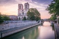 Notre Dame Cathedral of Paris and Seine river at dramatic dawn, France Royalty Free Stock Photo