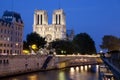 Notre Dame Cathedral and the river Seine at night Royalty Free Stock Photo