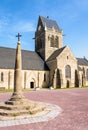 Notre-Dame-de-l\'Assomption church and calvary in Sainte-Mere-Eglise, Normandy Royalty Free Stock Photo