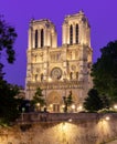 Notre-Dame de Paris cathedral and Cite island embankment at night, France Royalty Free Stock Photo