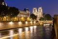 Notre-Dame de Paris cathedral on Cite island at night, France Royalty Free Stock Photo