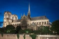 Notre Dame de Paris cathedral at night, side view Royalty Free Stock Photo