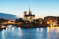 Notre dame de paris cathedral with Seine river at night in Paris Royalty Free Stock Photo