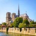 Notre-Dame de Paris cathedral under a blue sky on a sunny spring day Royalty Free Stock Photo