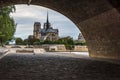 Notre Dame de Paris cathedral view from under the bridge on the Seine bank, Paris, France Royalty Free Stock Photo