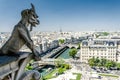 Notre-Dame de Paris. Famous Chimera demon overlooking the Eiffel Tower. Royalty Free Stock Photo