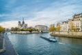 Notre-dame-de-Paris, the Seine river and a boat Royalty Free Stock Photo