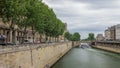 Notre Dame de Paris and Seine timelapse hyperlapse is the one of the most famous symbols of Paris Royalty Free Stock Photo