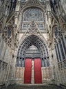 Notre Dame de Rouen Cathedral side entrance door. Architectural landmark facade details featuring styles from Early Gothic to late Royalty Free Stock Photo