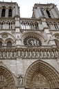 Notre dame entrance portal's decorations Saints sculptures detail.