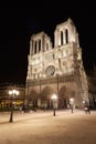 Notre Dame at night with people in Paris Royalty Free Stock Photo