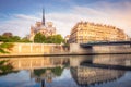 Notre Dame of Paris on Seine River reflection at peaceful sunrise, France Royalty Free Stock Photo