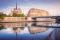 Notre Dame of Paris on Seine River reflection at sunrise, France Royalty Free Stock Photo