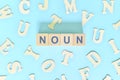 Noun or nouns concept in English grammar and learning class lesson. Wooden blocks typography word flat lay