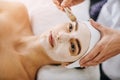 Nourished skin is happy skin. an attractive young woman getting a facial at a beauty spa.