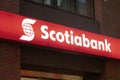 A Bank of Nova Scotia or Scotiabank sign at night. A Canadian multinational banking and