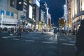 Nov 26 2023 Japan, Tokyo, Ginza, pedestrian traffic in street, dusk Royalty Free Stock Photo