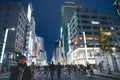 Nov 26 2023 Japan, Tokyo, Ginza, pedestrian traffic in street, dusk Royalty Free Stock Photo