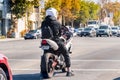 Nov 11, 2019 Palo Alto / CA / USA - Motorcyclist waiting at a traffic stop in San Francisco Bay Area