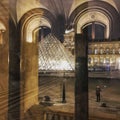 Reflections and reality at the Louvre at night, Paris, France