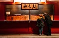 O-Mikuji fortune teller paper at Asakusa Sensoji temple with local people