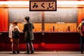 O-Mikuji fortune teller paper at Asakusa Sensoji temple with local people