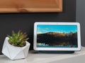 Nov 2019, UK - Google Nest Hub on mantlepiece with picture on show