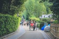 2 Nov 2013 Unidentified man with a rickshaw and tourists at Chikurin-no-michi Royalty Free Stock Photo