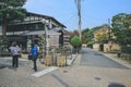 2 Nov 2013 Unidentified man with a rickshaw and tourists at Chikurin-no-michi Royalty Free Stock Photo