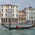 Nov 14, 2022: Venice, Italy - Gondolier carrying tourists on the Venetian Grand Canal Royalty Free Stock Photo