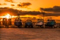 Row of sailing yachts, boats, sailboats parked in the marina harbor at sunset. Royalty Free Stock Photo