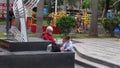 Shenzhen, China: Women`s parents take their children to play in the park Royalty Free Stock Photo