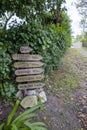 Novellana, Cudillero, Asturias, Spain - 03 June, 2023. Vertical shot Kilometer sign in the trail of saint james way, northern Royalty Free Stock Photo