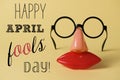 Novelty glasses and text happy april fools day Royalty Free Stock Photo