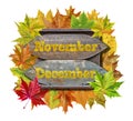 Novembar and Decembar wooden board with colorful leaves isolated