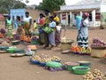 African women selling food on a dusty roadside