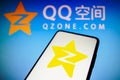 November 22, 2022, Brazil. In this photo illustration, the QZone logo is displayed on a smartphone screen