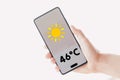 Thermometer showing 46ÃÂºC of heat is displayed on a smartphone screen Royalty Free Stock Photo