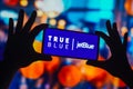 November 7, 2022, Brazil. In this photo illustration, the TrueBlue JetBlue logo is displayed on a smartphone screen