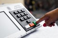 November 16, 2020, Brazil. In this photo illustration a woman simulates a vote in the electronic ballot box used in the elections