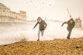 Dangerous rough Desmond storm waves hit boys on beach